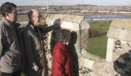 Guide Alan Moss, centre, shows visitors David and Valerie Newby from Bromley the views. Picture: PETER STILL