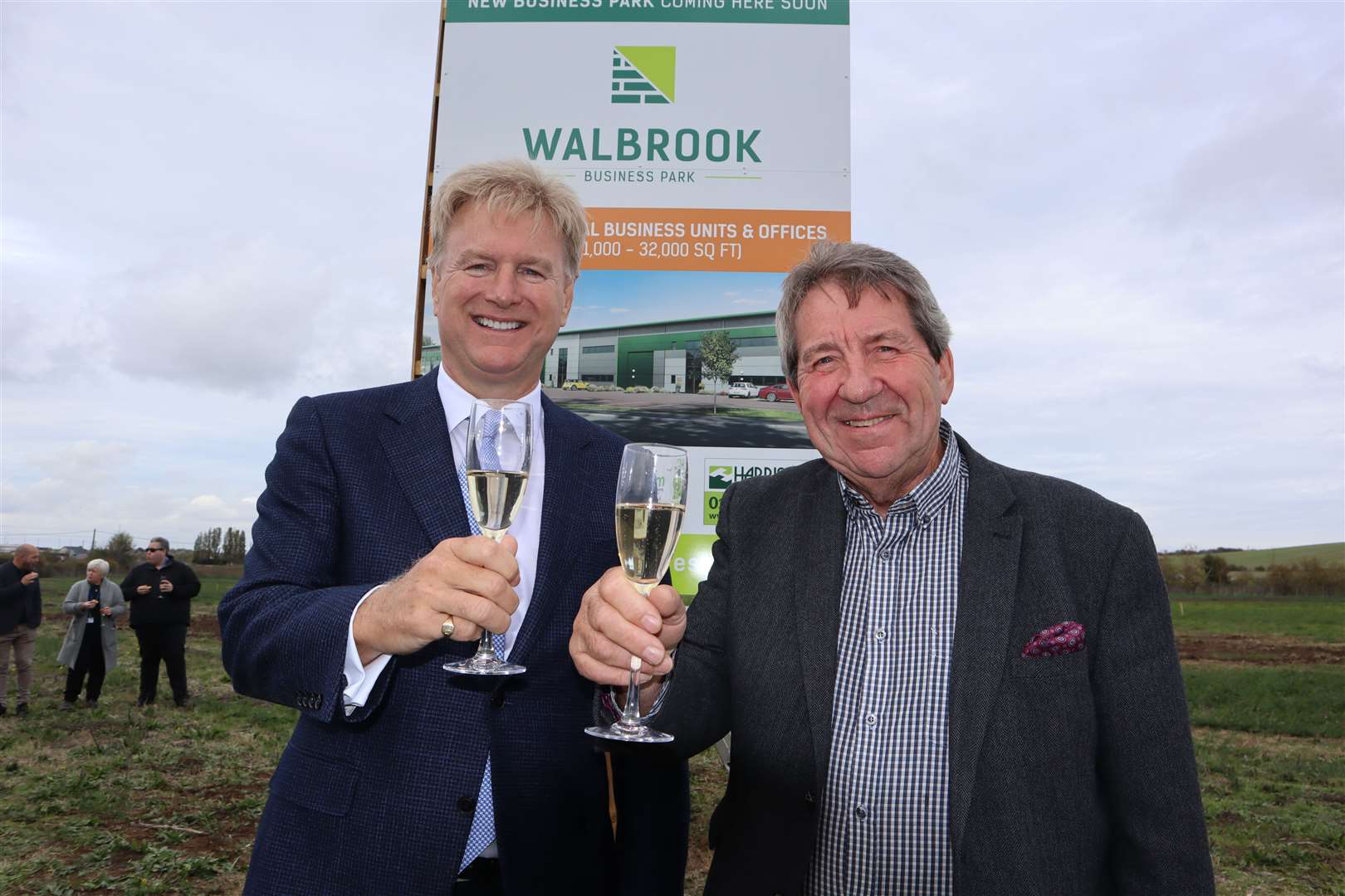 Tom Allsworth of Medichem, left, and MP Gordon Henderson toasting the launch of Walbrook Business Park at Neats Court, Queenborough