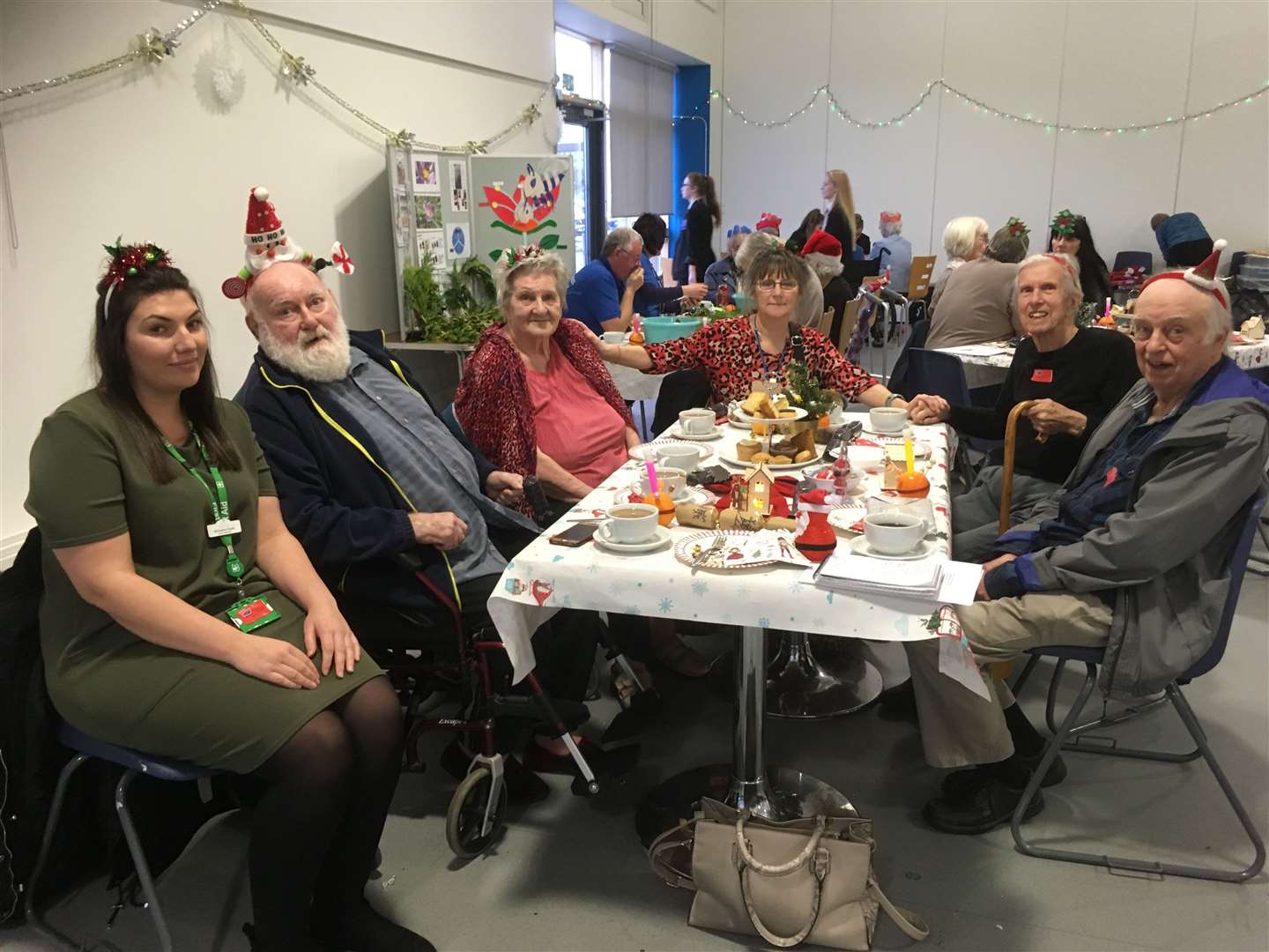 Residents of Oakdene Rest Home, Minster, at the Oasis Academy Christmas dementia cafe with carer Michaela Payne, left, and events coordinator Maud Medley (7660430)