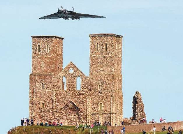 The Vulcan flies over the Reculver Towers