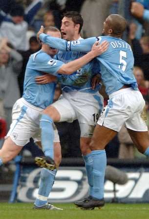 Richard Dunne celebrates City's opening goal with team mates. PICTURE BY MATTEW WALKER