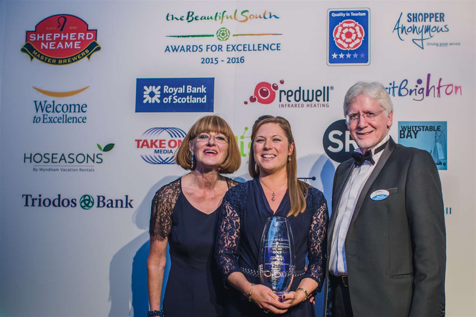 Samantha Jeal, centre, is presented with her award by Sue Gill, training director of Welcome to Excellence, and Nigel Collins, chief executive of Tourism South East