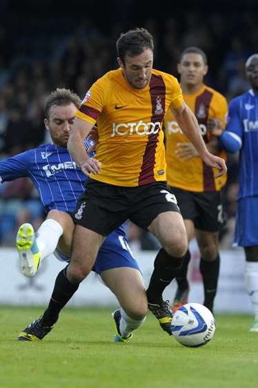 Charlie Lee was booked for this challenge against Bradford on Saturday. Picture: Barry Goodwin
