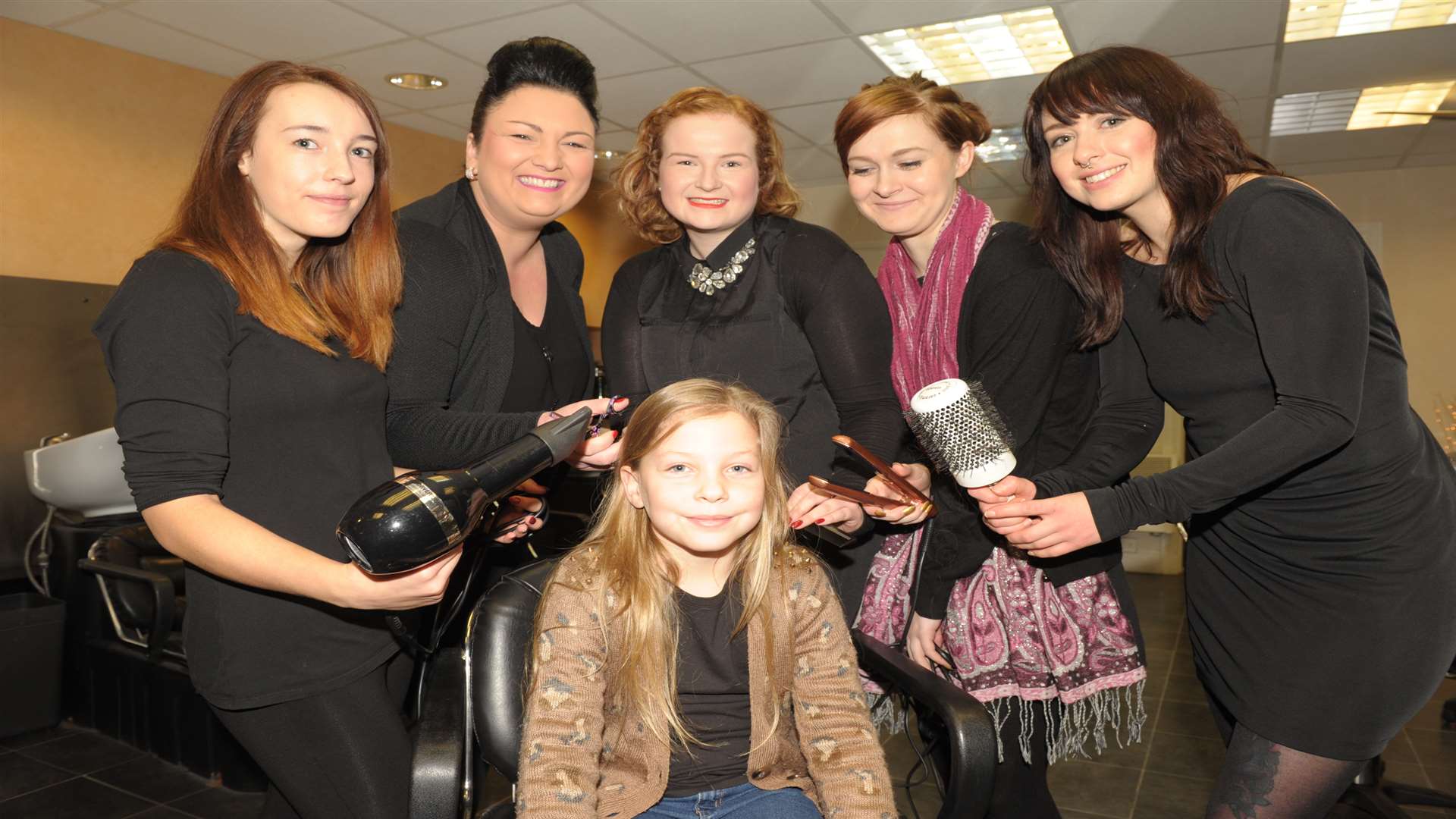 Olivia Newman, eight, had her hair cut for charity