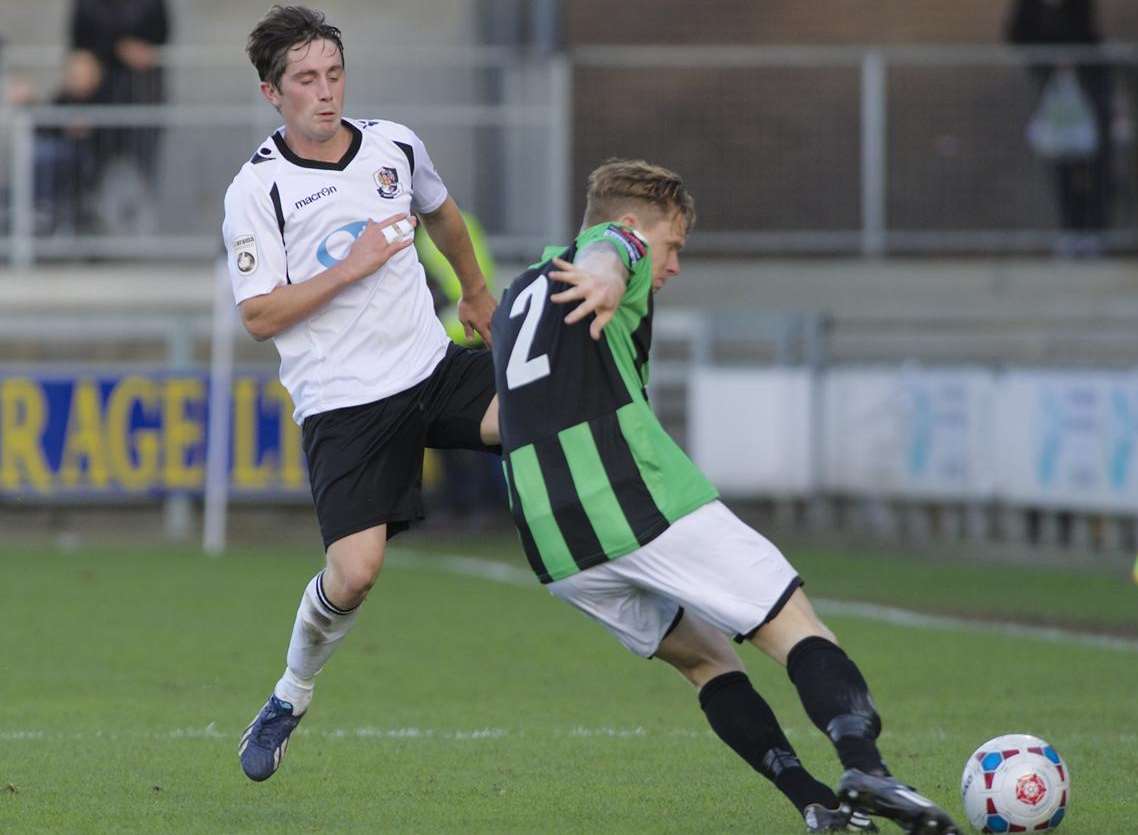 Dartford's Lee Noble beaten to the ball by Burgess Hill's Neil Watts Picture: Andy Payton FM3477654
