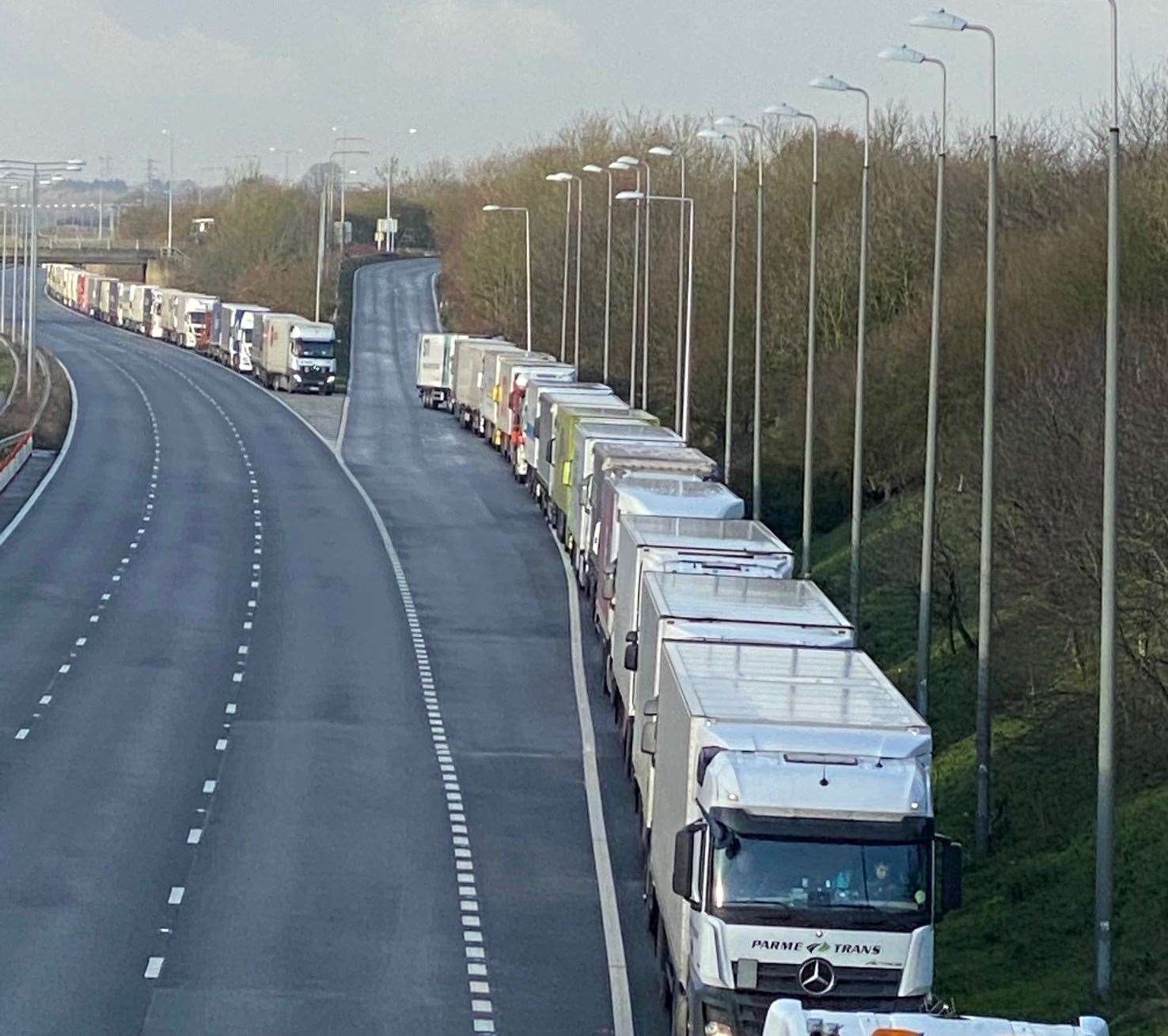 Lorries queue on the M20 near junction 11 whilst they await being able to board at the Eurotunnel terminal Picture: Barry Goodwin.