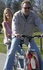 VIC Reeves and new wife Nancy take to two wheels