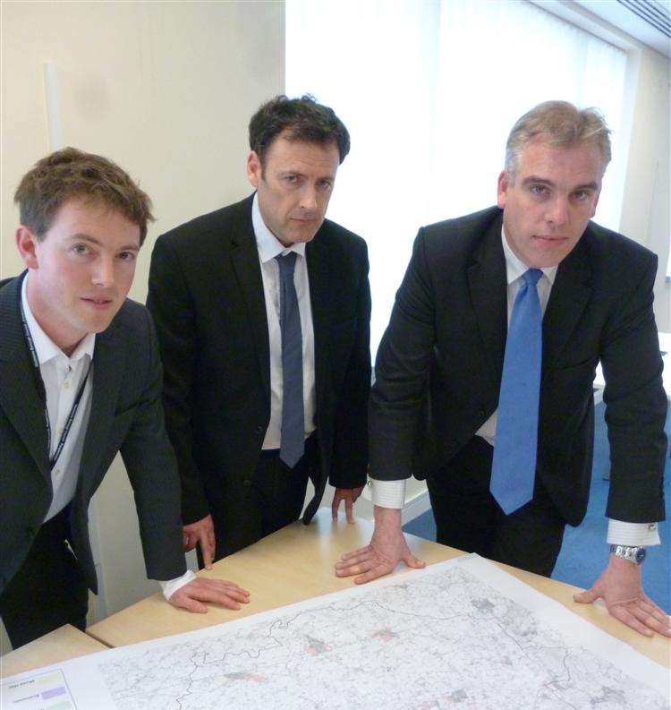 Cabinet member Stephen Paine, chief planning officer Rob Jarman and council leader Chris Garland examine a map of the proposed sites