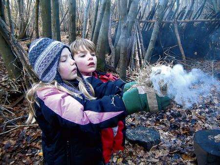 Rebecca and Bryn Scholefield learn to build a fire at Natural Pathways