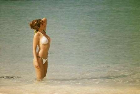 Rochester's Kelly Brook in the revealing white bikini. Picture: THE WORKS UK DISTRIBUTION