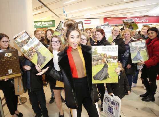 Calendar girl The Only Way Is Essex star Megan McKenna surrounded by fans at The Mall, Maidstone. Picture: Matthew Walker