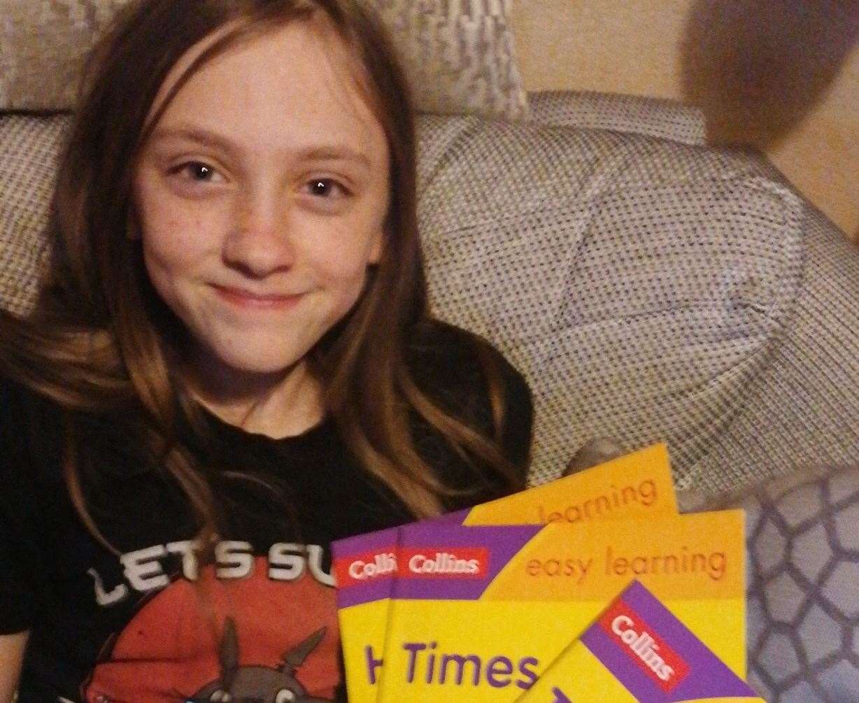 Mia with some of the books that have been purchased via the Amazon Wish List since she put an appeal out