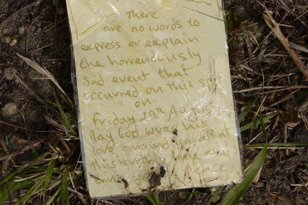 One of several messages and floral tributes left at the crash site