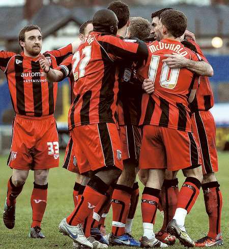 Chris Whelpdale celebrates his goal against Macclesfield with Gillingham team-mates