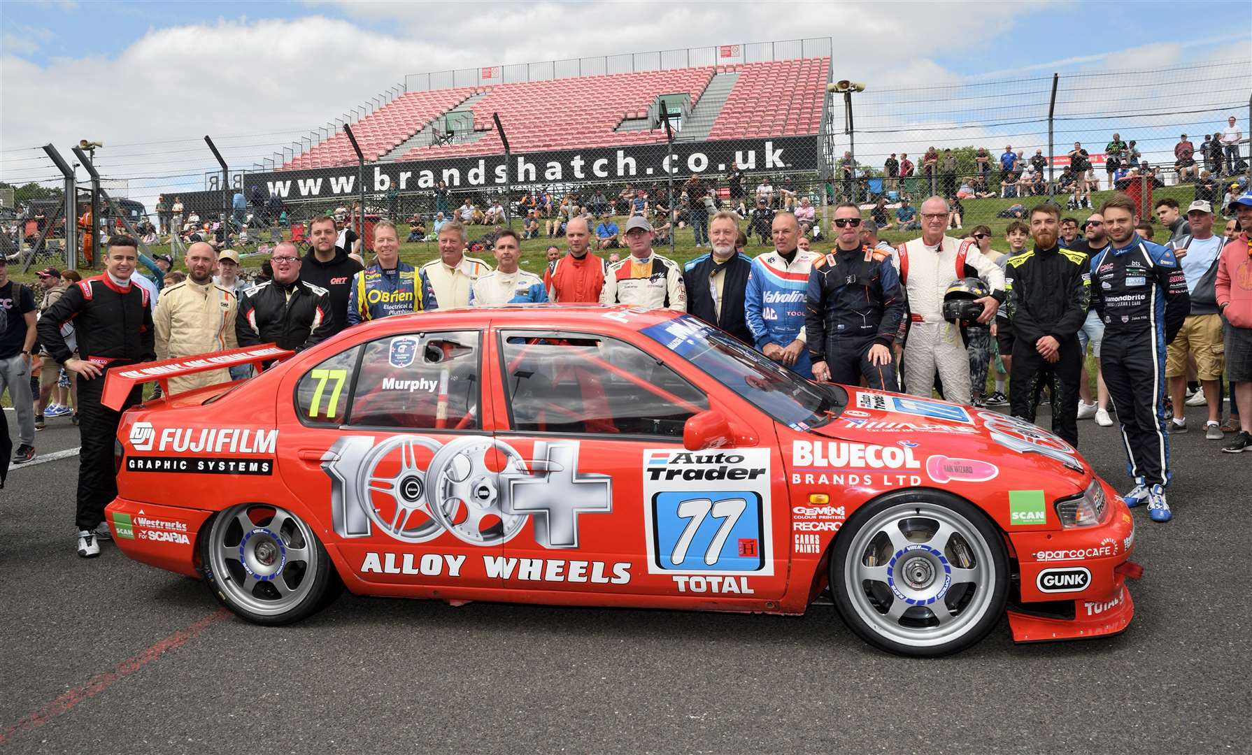 The Super Tourer drivers paid tribute to Team Dynamics founder Steve Neal, who has died at the age of 82. They are pictured with the ex-Matt Neal Nissan Primera, which was wheeled to the front of the grid on Sunday. Picture: Simon Hildrew
