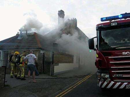 Firefighters tackling the blaze at the Halfway House pub
