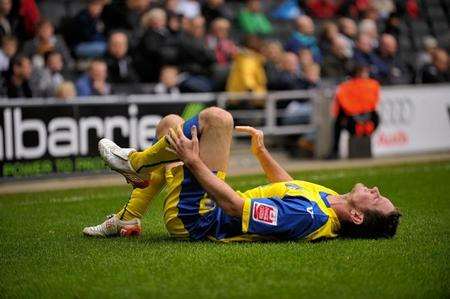 New Gills signing Scott Vernon is injured on his debut against MK Dons. Picture: Barry Goodwin