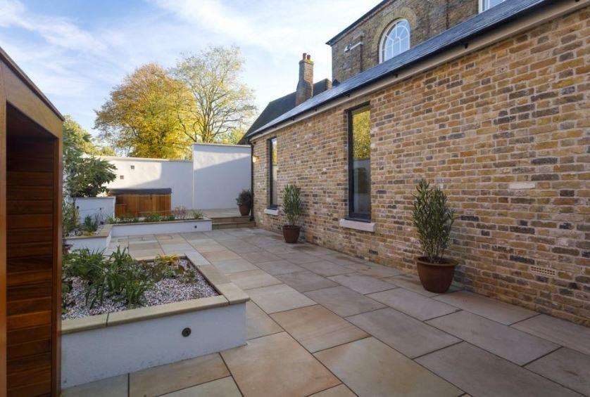 The property has a private, walled rear courtyard (6728686)