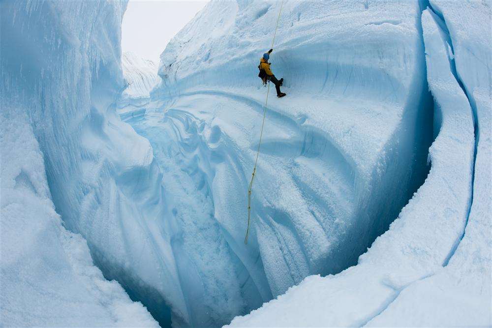Rappelling at Survey Canyon where there's a 2,000ft drop through the Greenland Ice Sheet. Picture: Jeff Orlowski.