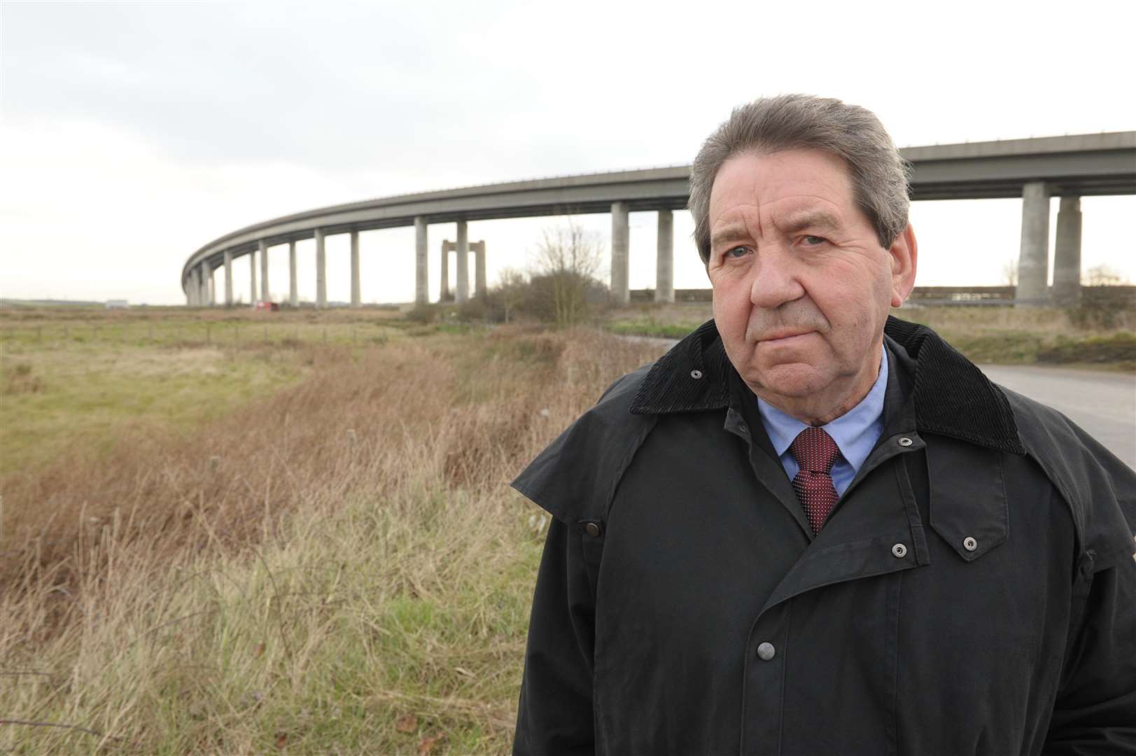 The road to Ridham Dock.MP Gordon Henderson standing by the Sheppey Crossing.Picture: Steve Crispe