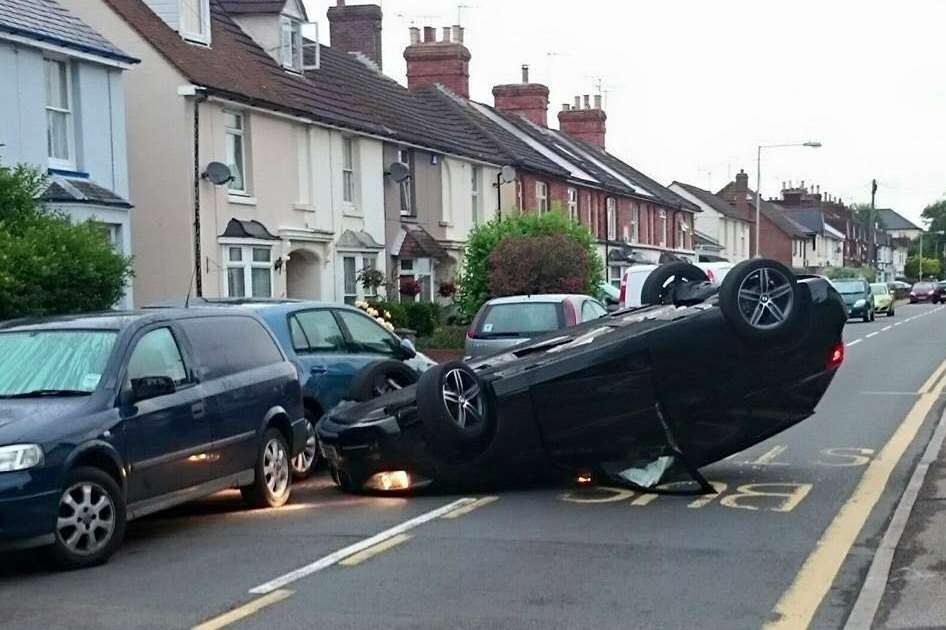 A driver had a lucky escape when his car overturned in Hunter Road, Willesborough. Picture: Helen Quinn