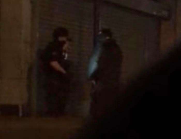 Armed police in the shadows in Sheerness High Street on Saturday night