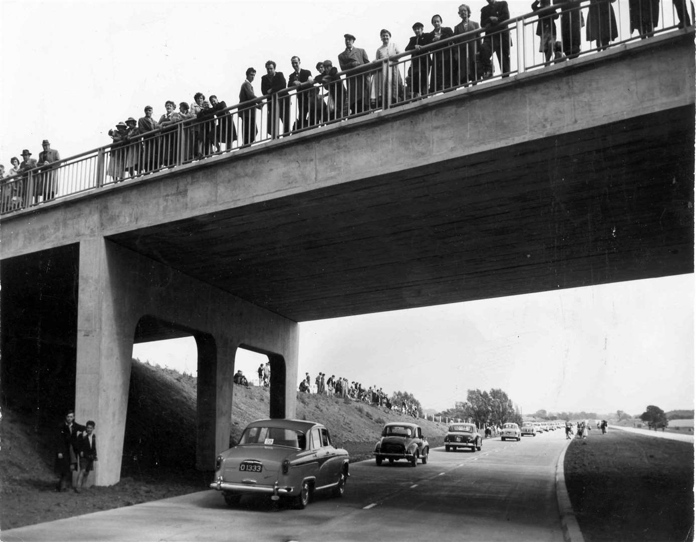 Crowds gathered to watch a cavalcade of vehicles to mark the opening of Ashford bypass in 1973 which brought relief to the traffic-choked town centre. Picture: Images of Ashford by Mike Bennett