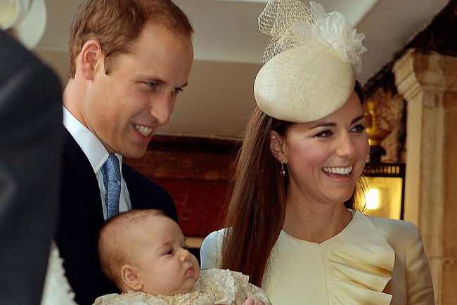 The Duke and Duchess of Cambridge with Prince George at his christening. Picture: John Stillwell/PA