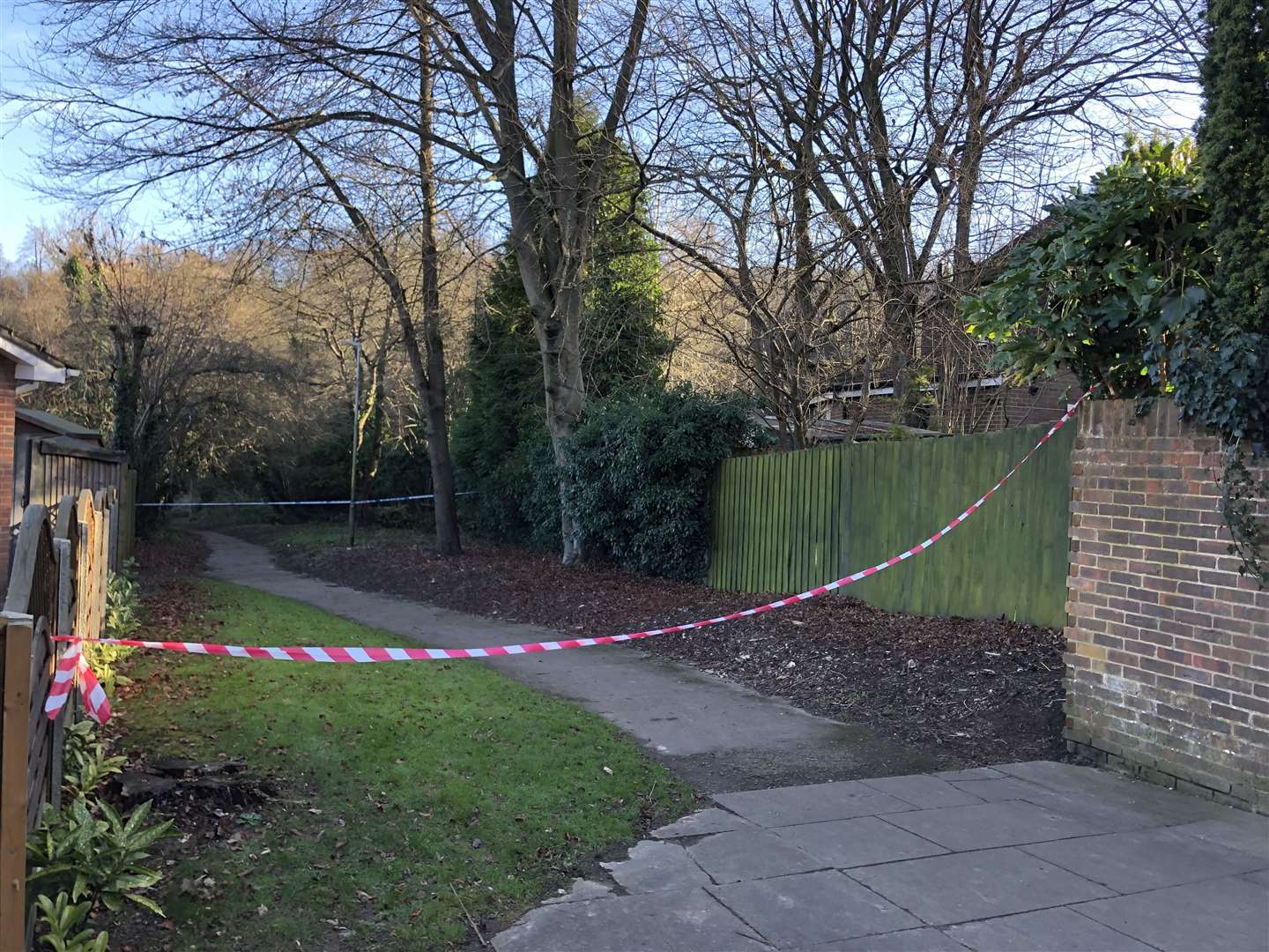 Part of the footpath behind the property has been cordoned off
