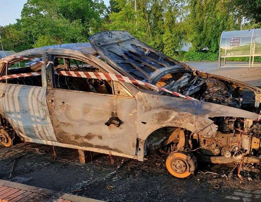 A car has been torched in Sainsbury's car park in New Romney. Picture: Chris Ainsley