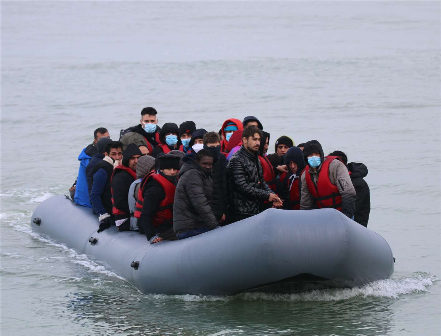 Asylum seekers landing on the beach in Kent.