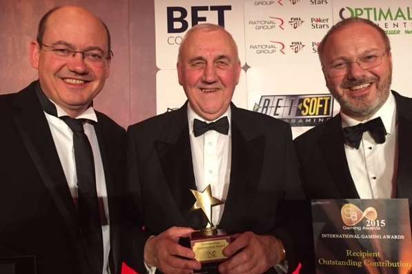 Bill Cammegh, centre, with his Outstanding Contribution Award alongside sons Andrew, right, and managing director Richard