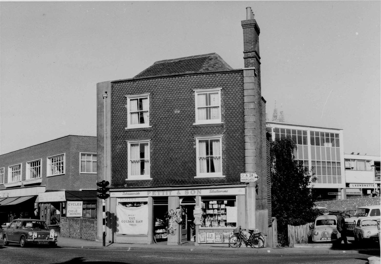 Canterbury newsagent and tobacconist Eric Pettit moved from St George's Gate, where the family business had been for 118 years, to Burgate to make way for the second stage of the ring-road in 1968