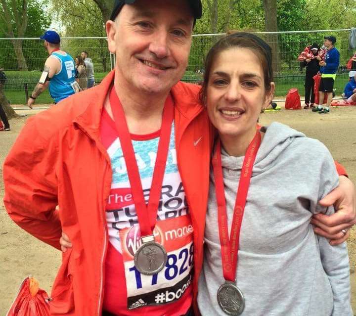 Chris Pegler and husband James at the finish of the marathon