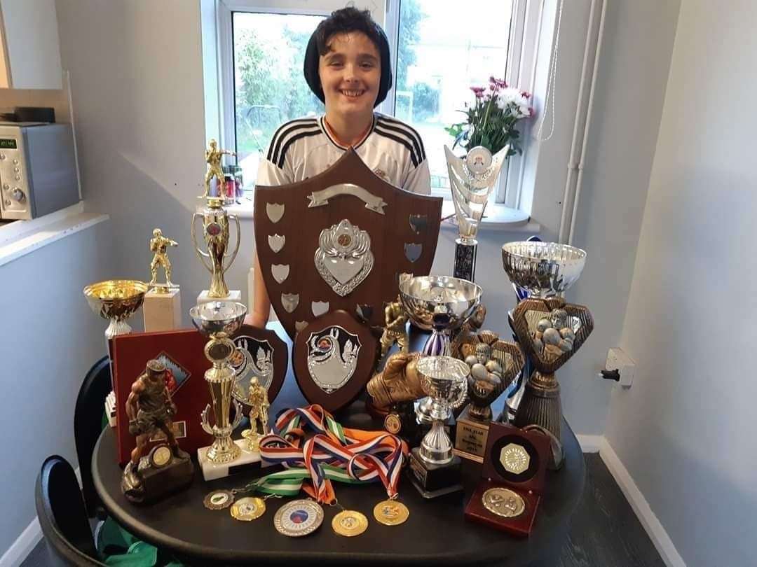 'Little Rocky' Liam Evans with his collection of boxing medals and trophies