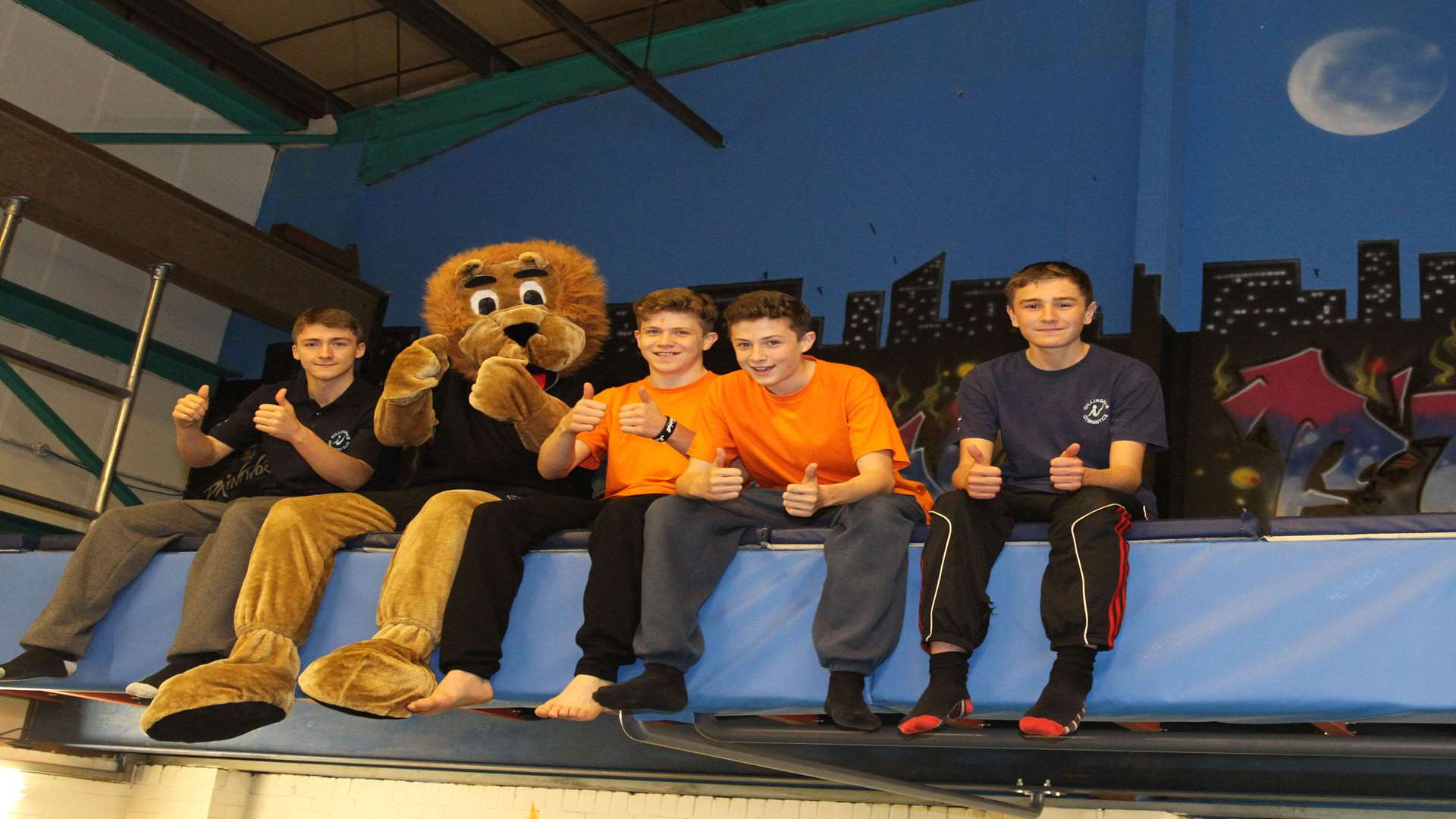 Mascot Romeo the Lion with members of the Free G team at Gillingham Gymnastics Club