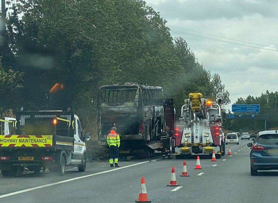 Laura Vinnicombe took this photo of the bus after the flames were put out and said there were still huge delays on the M2