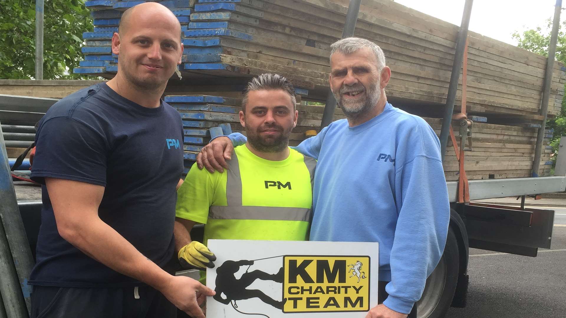 Chris Mosdell, Jay Marshall, John Walker of P&M Scaffolding show their support for the KM Maidstone Abseil Challenge.
