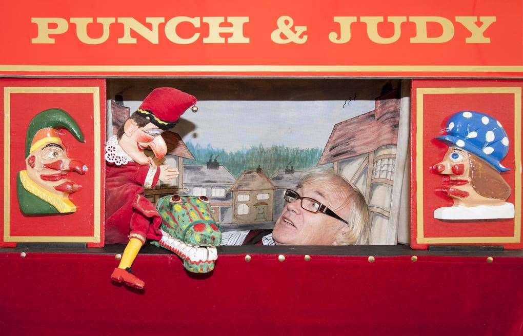 Myles performing a Punch and Judy show