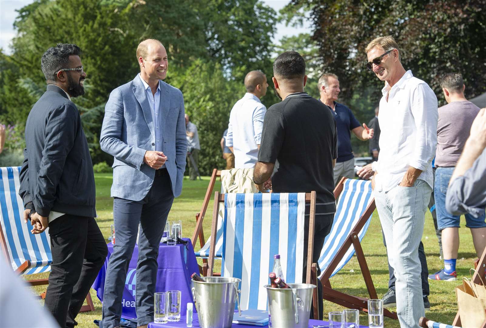 The Duke of Cambridge chats with Romesh Ranganathan (left) and former Arsenal player Tony Adams (Tim Merry/Daily Express)