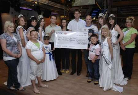 Managers and family from FS Leisure present the cheque for £2,000 to the Deal Carnival Court