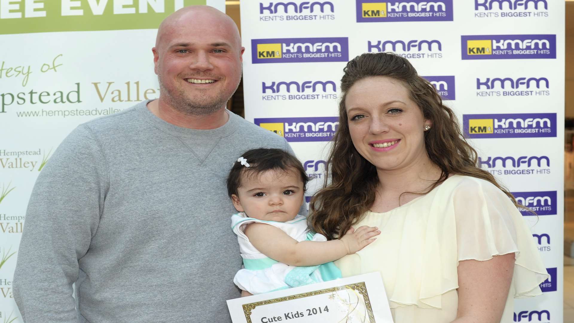 kmfm's Andy Walker with Claire Lewis and Esme Pook, 3rd in 0-24mths. 2014