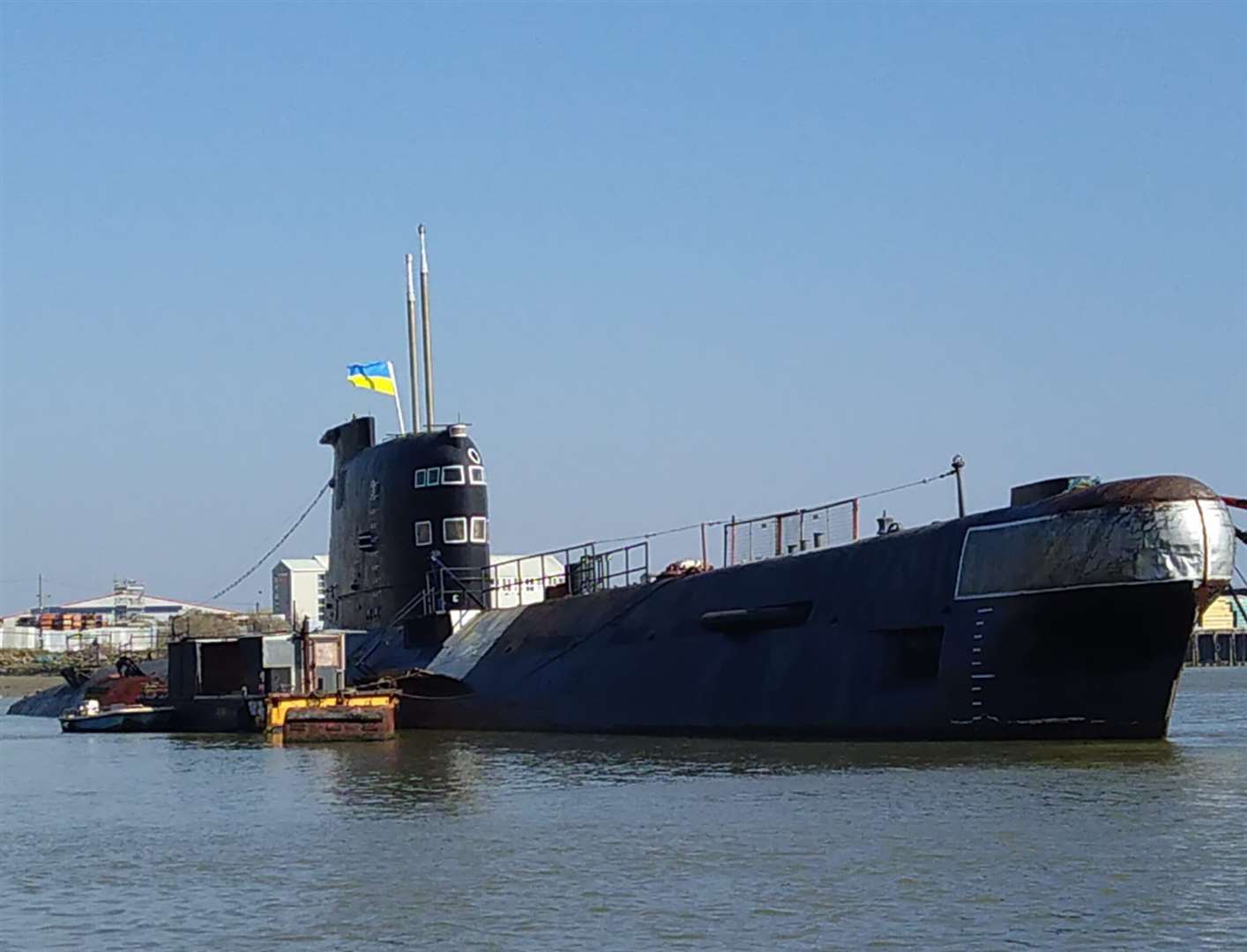 The Ukrainian flag flying on the Russian submarine moored on the River Medway