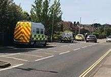 Police patrol cars and vans at the scene in New Dover Road. Picture: Timothy Playfair