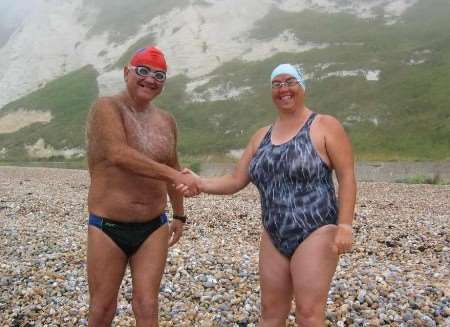 Kevin Murphy and Alison Streeter shake hands before starting today's relay swim. Picture: GRAHAM TUTTHILL
