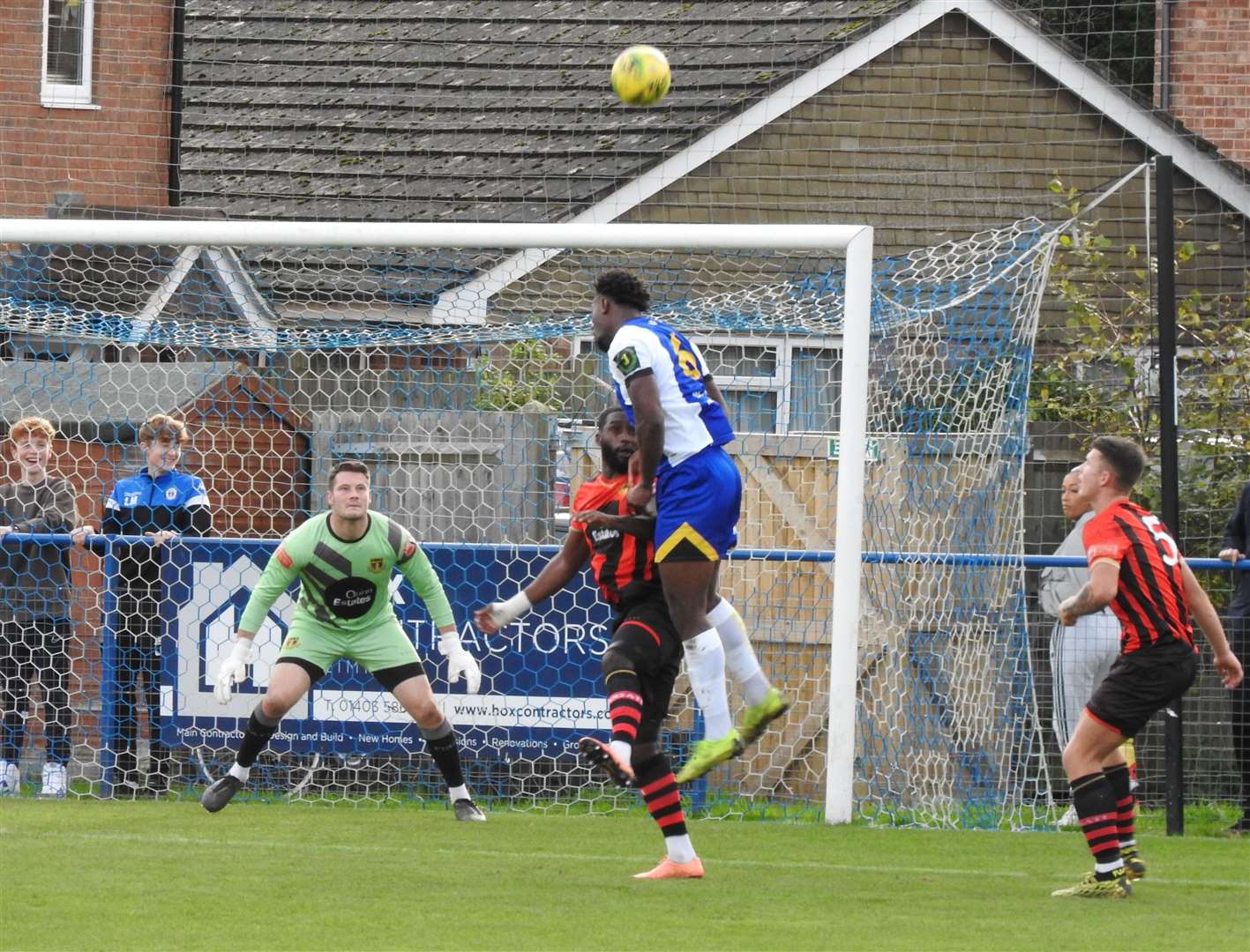 Harrison Pont, son of Brickies No.2 Darren Pont, watches on as Sittingbourne contest a header at Haywards Heath Picture: Peter Pitts