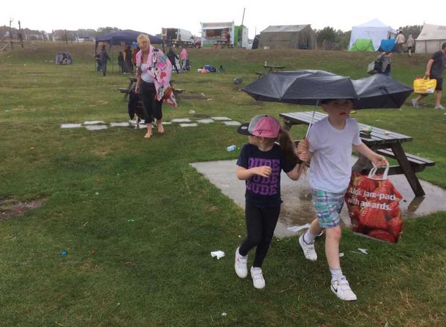 Spectators trying to flee a downpour at the Sheppey Pirates festival. Picture: John Nurden