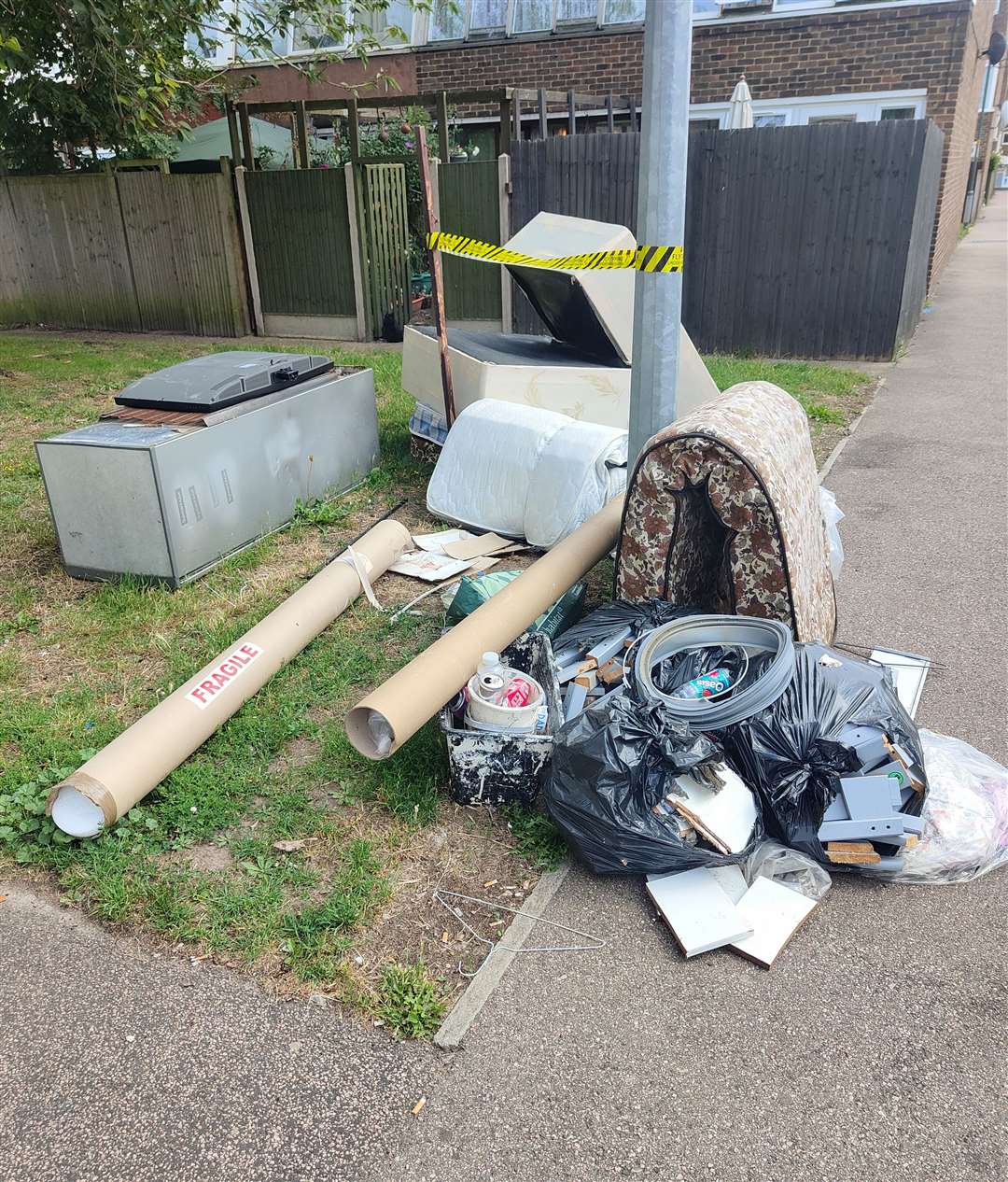 Mattresses, sacks of rubbish, fridges and cardboard have been there for 8 weeks according to Mrs Norris.