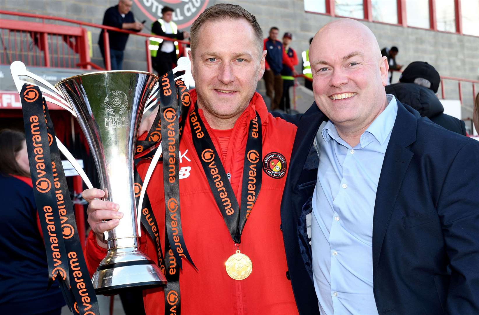 Ebbsfleet boss Dennis Kutrieb celebrates his side's 2022/23 National League South title win with chief executive Damian Irvine. PIcture: Simon Hildrew