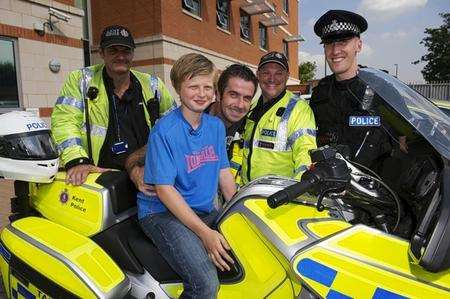 Reece and dad Tony McGhee with PCs Giles Lamb, Mark Sutton and Darren Searle, who was first to the scene